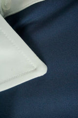 Men's collared long-sleeved technical sports shirt with lettering on the sleeve.